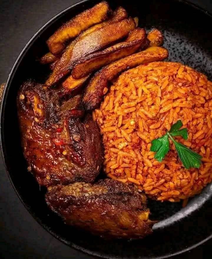 Jollof rice with fried plantain and grilled chicken