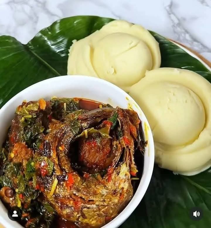 Pounded yam with fish vegetable soup